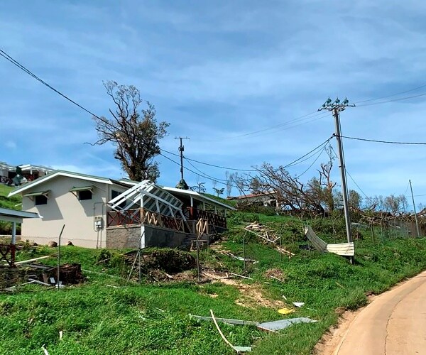 a house is wrecked by cyclone harold with the wooden structures and roof broken