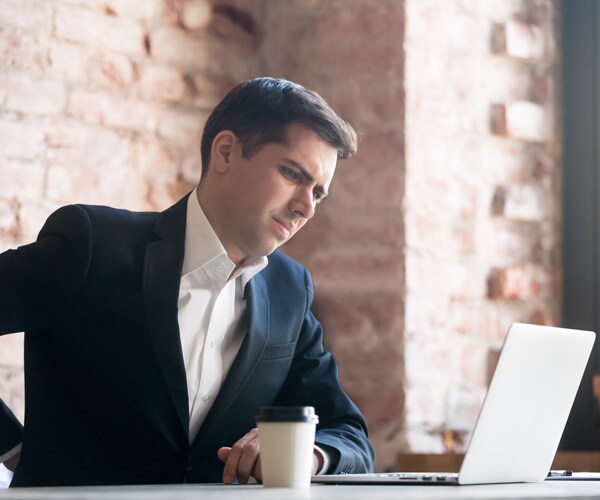 A man works at his computer