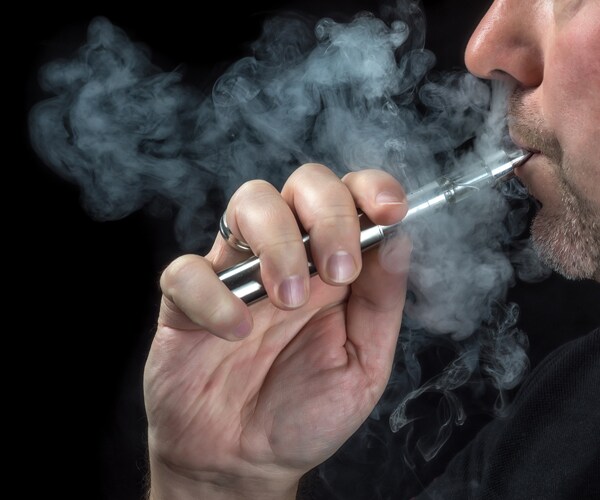 a man using a vaping device