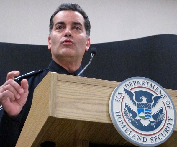 robert perez speaks into microphone