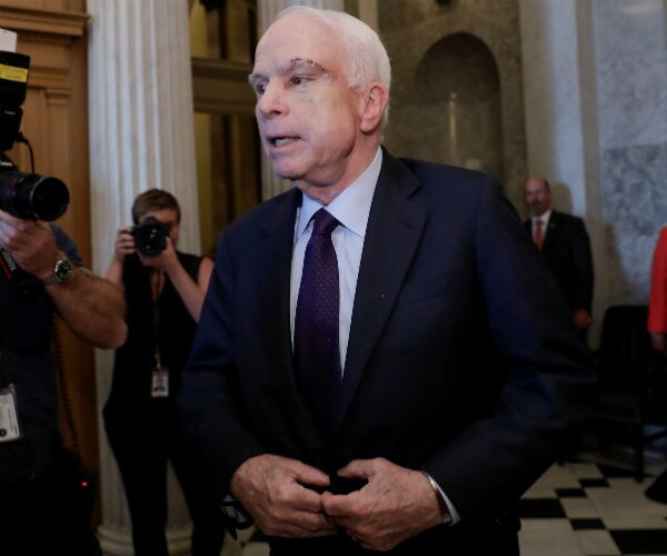 sen john mccain following obamacare vote last year 