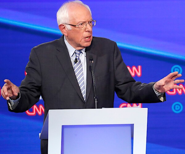 bernie sanders gestures during the presidential primary debate