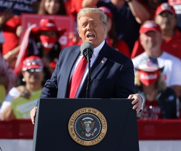 donald trumps speaks from behind podium