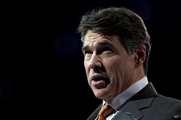 Texas Gov. to Speak at Memorial for Slain DA, Wife