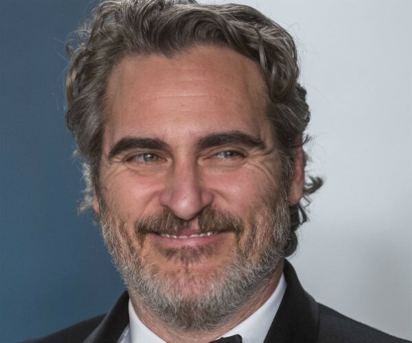 joaquin phoenix is shown in a tuxedo