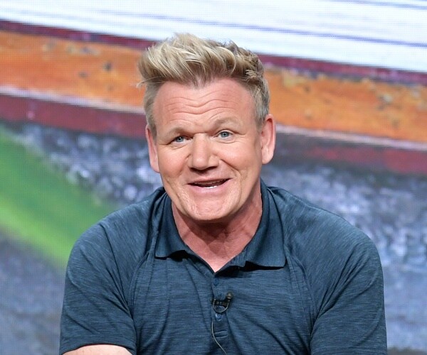gordon ramsay sits onstage