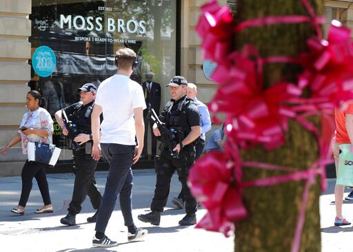 The Latest: UK Eases Terror Threat Level