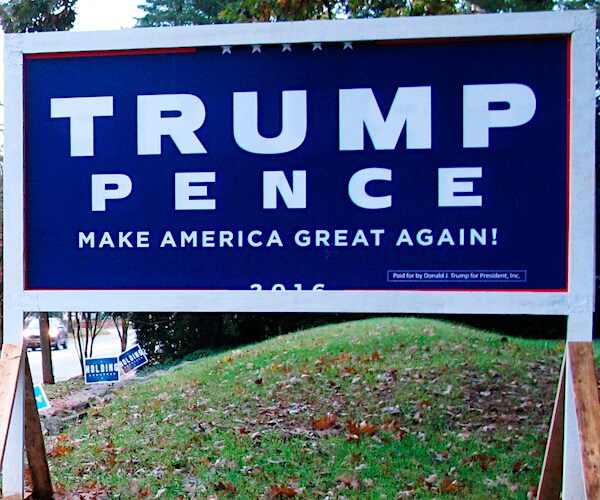 a campaign sign for president donald trump and running mate vice president mike pence