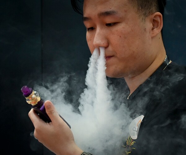 A man using an e-cigarette