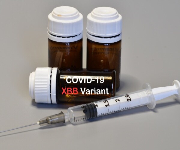 syringe, vaccine in vial labeled xbb