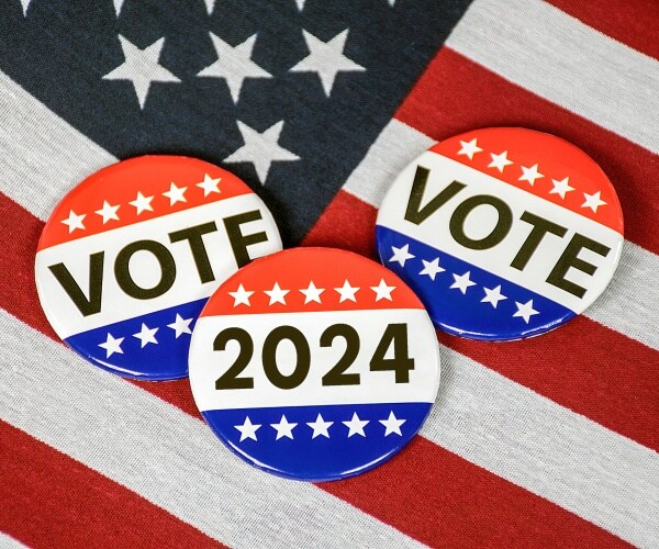 election campaign buttons for 2024 on a united states flag