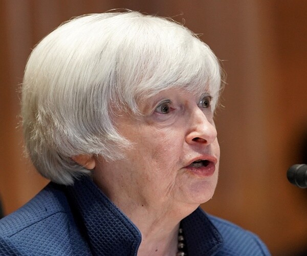 janey yellen speaks into mic