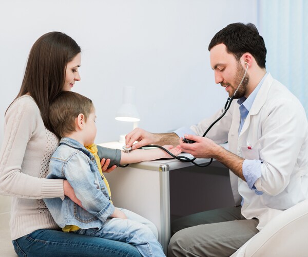 Checking a child's blood pressure
