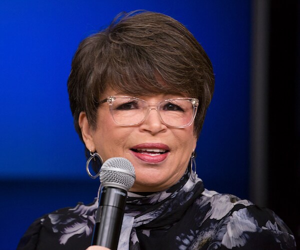 Former President Barack Obama adviser Valerie Jarrett speaks into a mic
