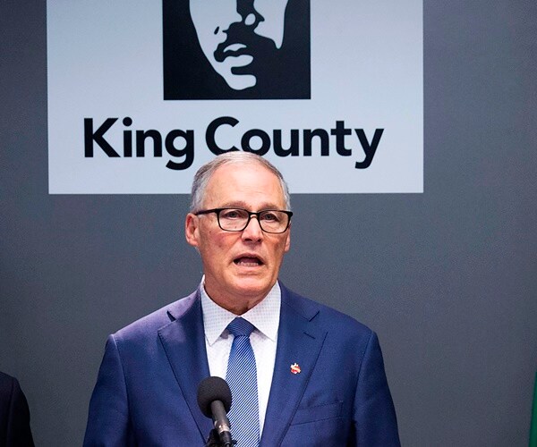 surrounded by his health officials, gov. inslee discusses coronavirus updates in washington