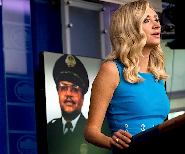 kayleigh mcenany speaks during a press briefing with david dorn's photo behind her at the podium