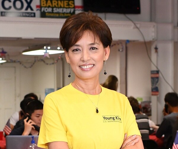 young kim poses for camera