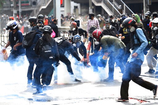 Thai Police Fire Tear Gas at Protest over COVID Response