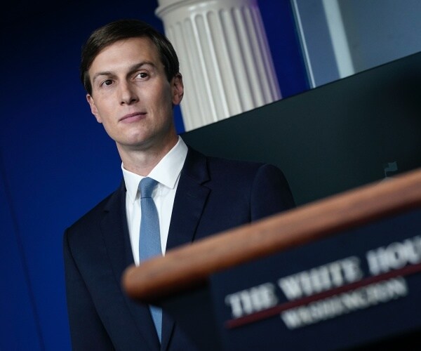 Jared Kushner stands by the podium in the white house