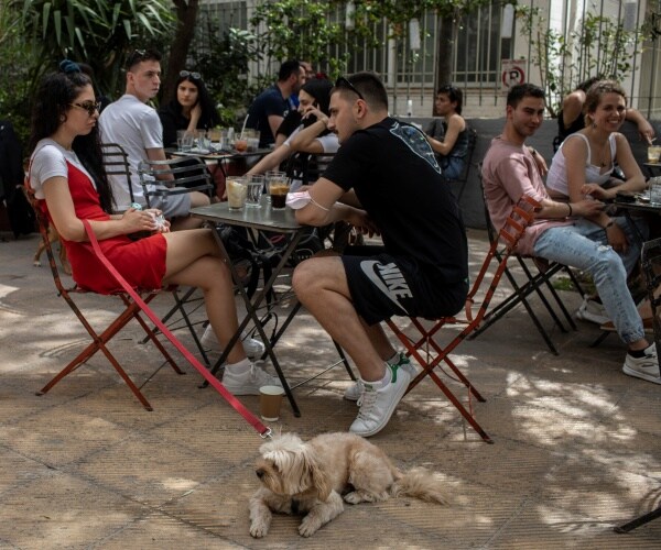People drinking coffee outdoors.