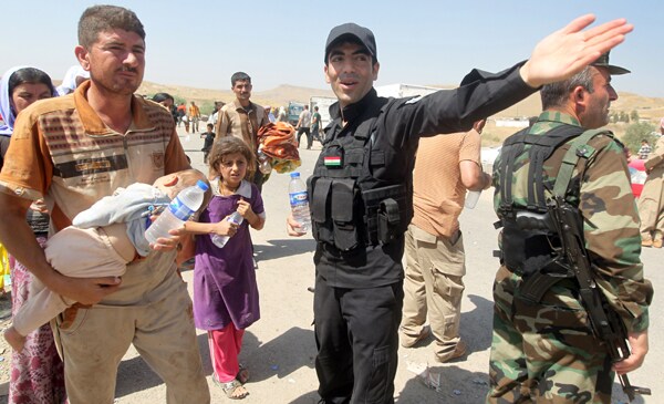 Syrian Kurdish Fighters Rescue Stranded Yazidis