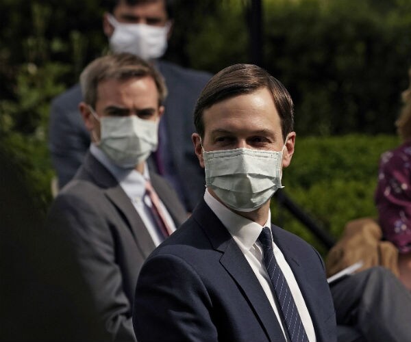 jared kushner is shown wearing a mask in white dressed shirt, navy suit and tie