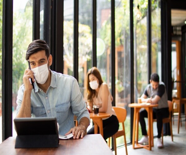 people wearing a mask in coffee shop