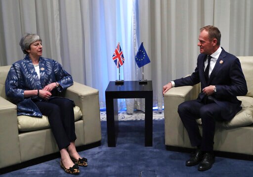 The Latest: Tusk Urges May to Request Brexit Extension
