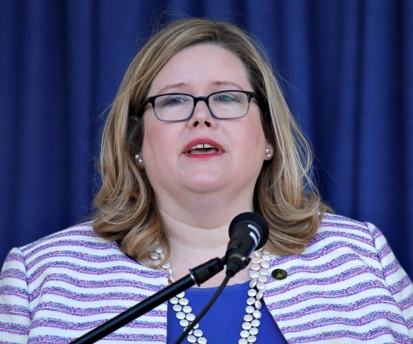 emily murphy speaks from podium