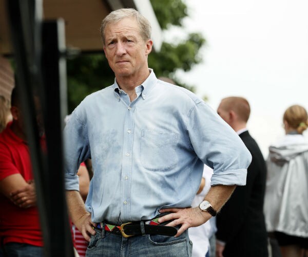 tom steyer waits to speak at the des moines register soapbox during a visit to the Iowa state fair in des moines, iowa