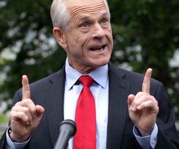 peter navarro stands in driveway