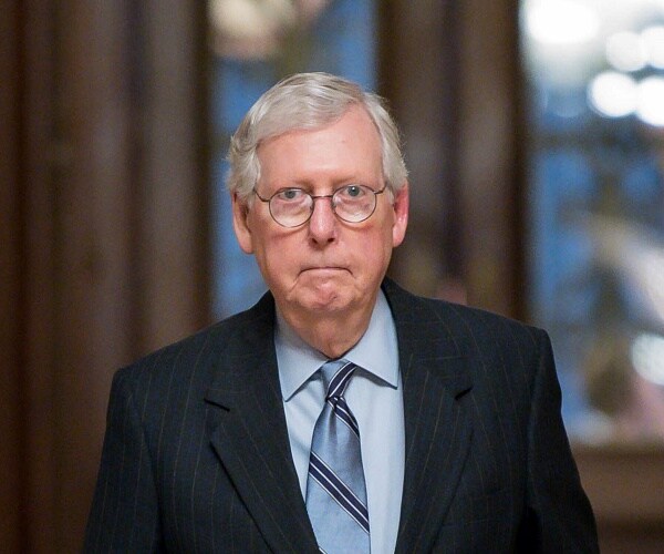 mitch mcconnell walks through us capitol 