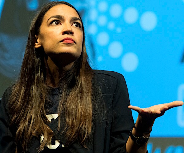 democratic representative alexandria ocasio-cortez puts her left palm up in bewilderment
