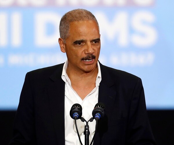 eric holder speaks at a rally
