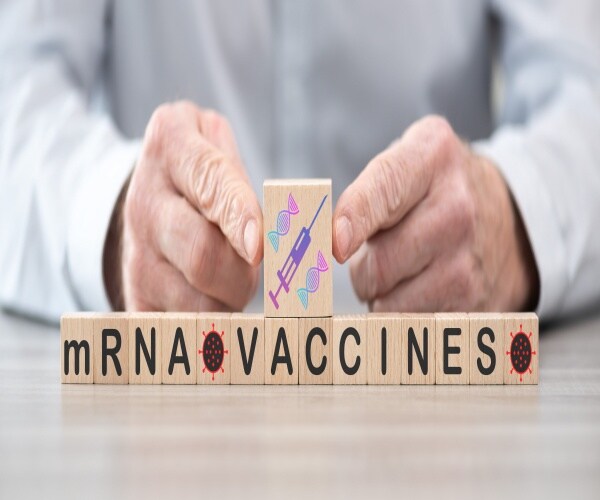 Wooden blocks spell out mRNA vaccine