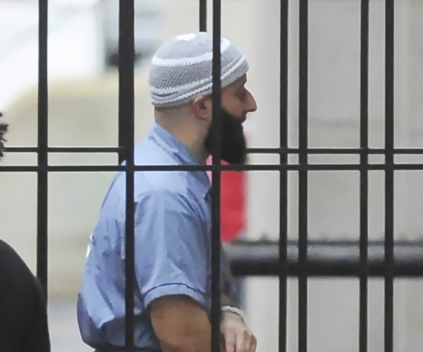adnan syed entering a courthouse