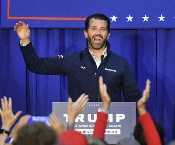 donald trump junior raises hand