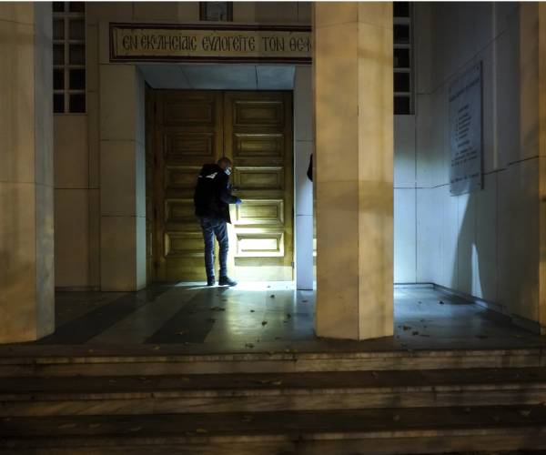 police officer in front of church door
