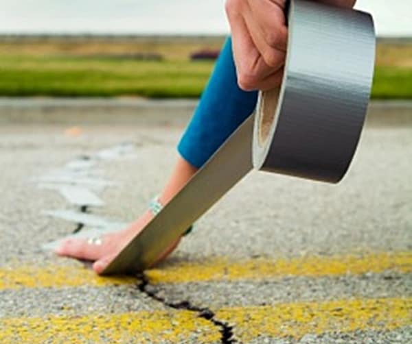 duct tape fix to troubled crumbling roads