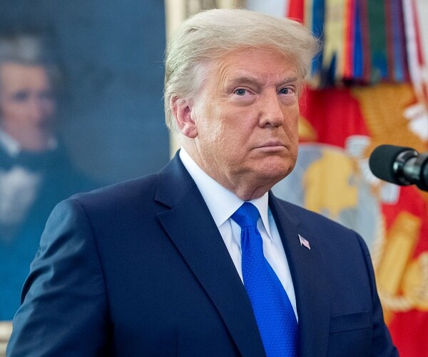 donald trump stands in oval office