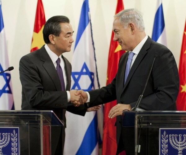 benjamin netanyahu shakes hands with chinese foreign minister wang yi
