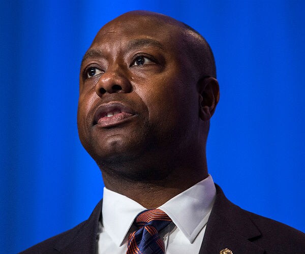 sen. tim scott is shown in a suit