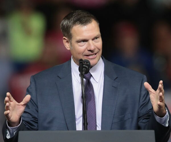 kris kobach speaks during a donald trump rally