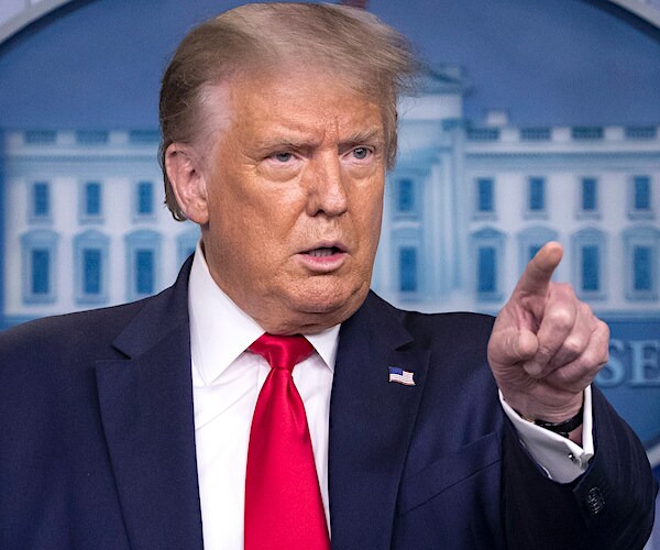 president donald trump points to a reporter at the daily press briefing