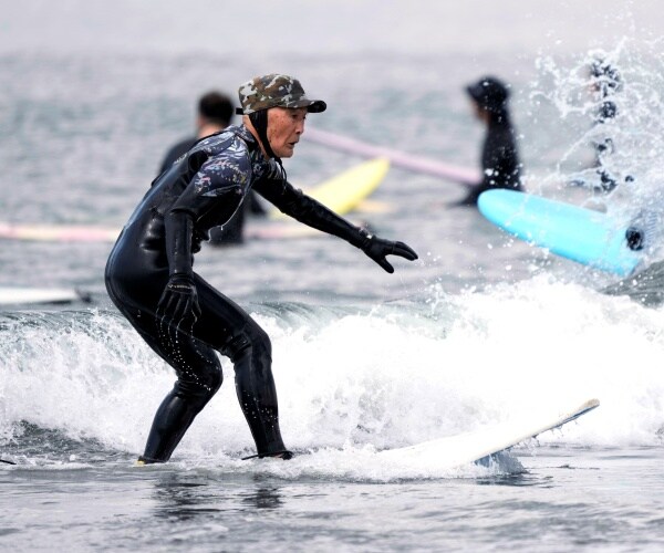 a man surfing