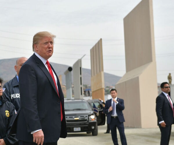president donald trump at the border wall