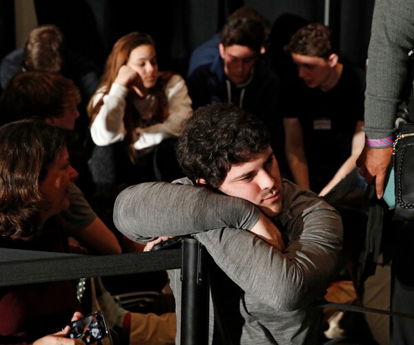 people wait for results at the iowa caucuses monday evening