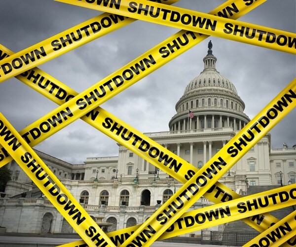  yellow hazard tape reading shutdown blocking off us capitol steps