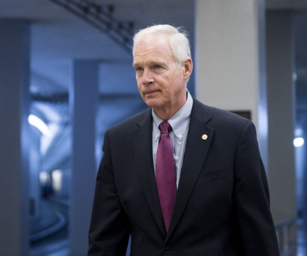 wisconsin republican senator ron johnson walks through the halls of capitol hill