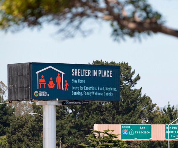 a billboard in california instructing residents to stay at home